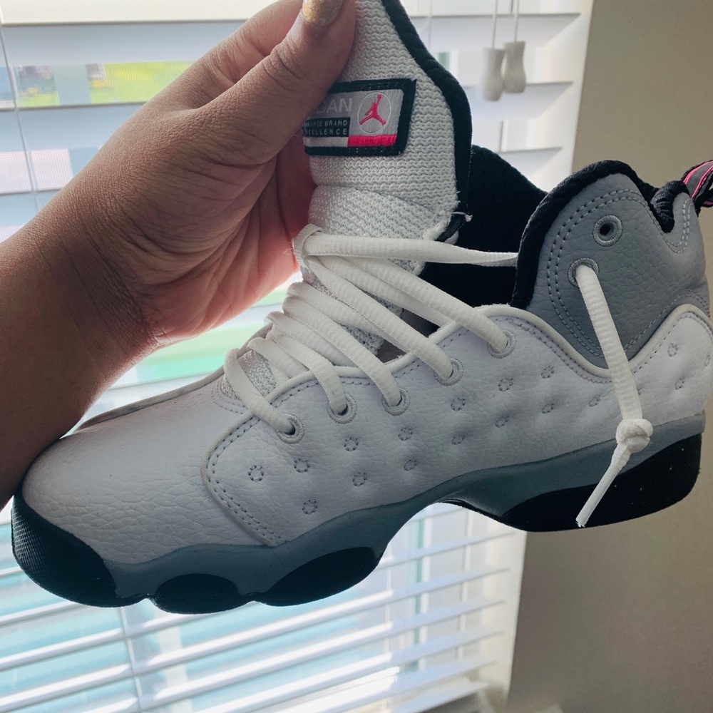 Pink, Black, Grey  and White Jordan 13’s.